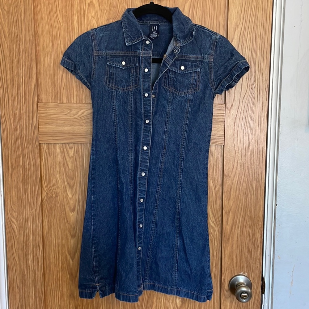 Like new jean dress with button closures.